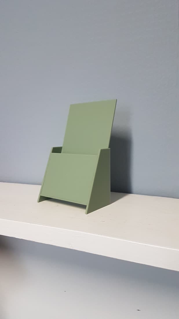 Green acrylic literature and brochure holder stand for government office reception areas