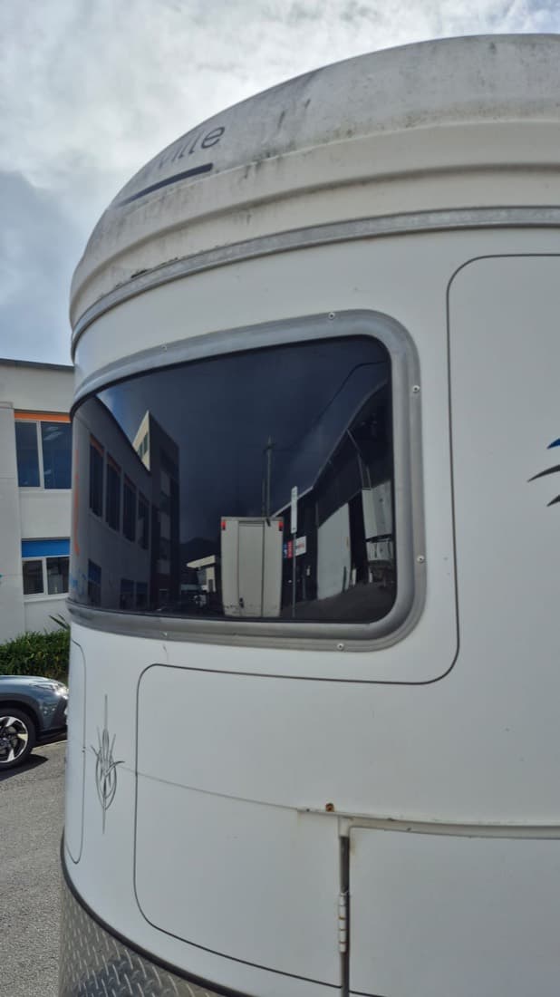 Replacement acrylic window fitted to a horse float during a maintenance repair